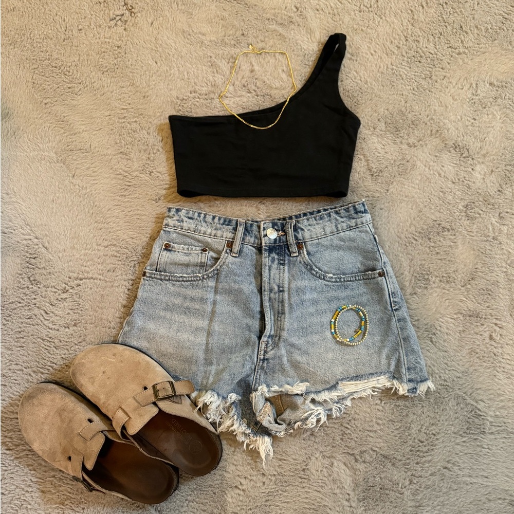 Light wash Zara shorts. Super cute just do not fit me anymore. Worn a few times.